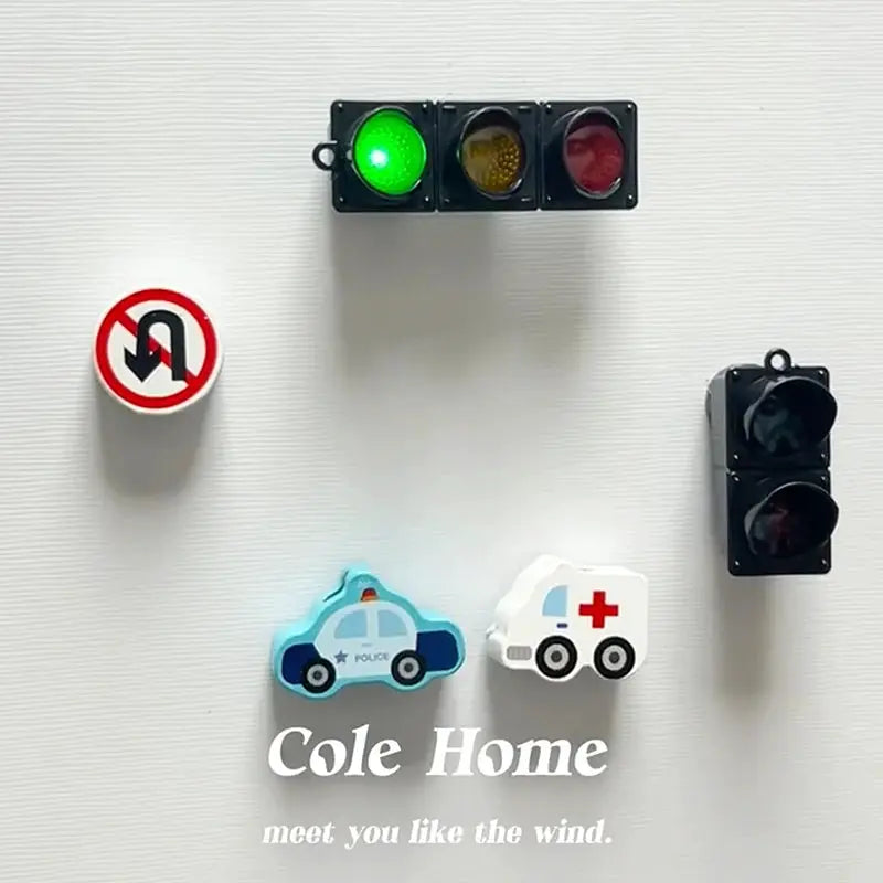 Traffic light magnetic refrigerator magnets; includes green-lit signal, police car, ambulance, and no U-turn sign.
