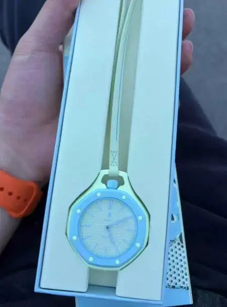 Simples Market AP Swatch style watch with blue dial and pale gold metal strap in box