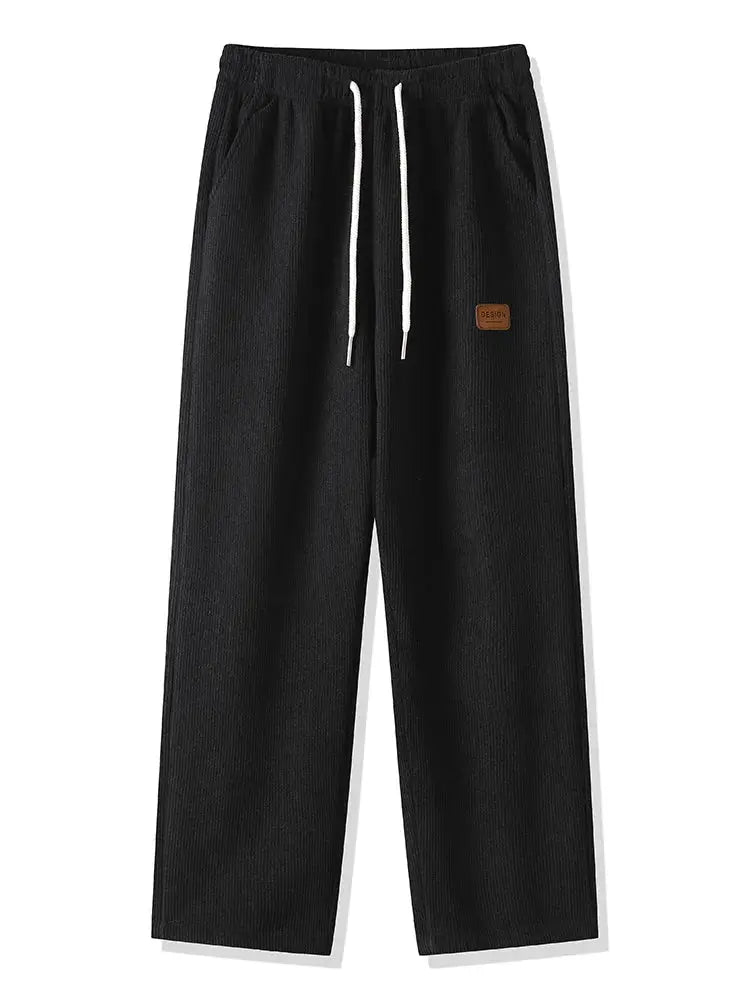 Men's black corduroy sweatpants with white drawstring, straight loose fit, brown patch on the thigh