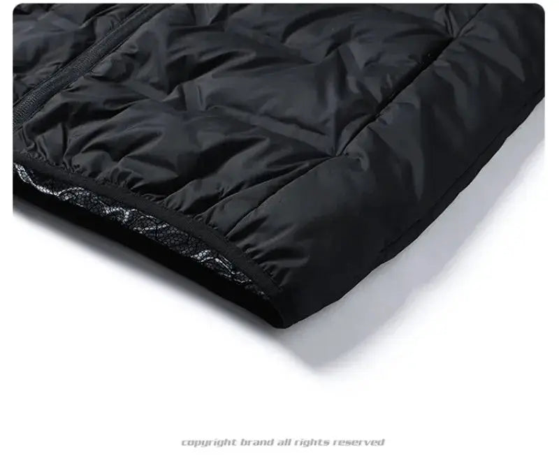 Winter down jacket for men, black quilted outerwear with elastic cuff and zipper.
