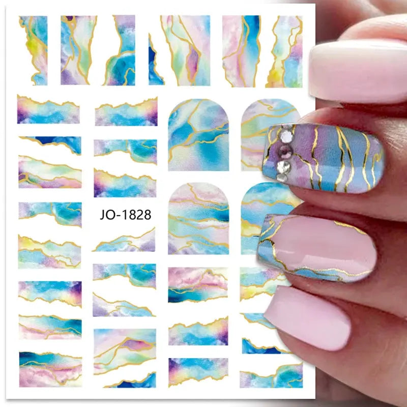 Nail art decals sheet with colorful marbled stripes and gold foil lines for 3D Y2K style nails