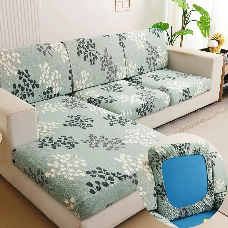 Sofa slipcover set for L-shaped couch by Simples Market in light teal with white and charcoal leaf pattern