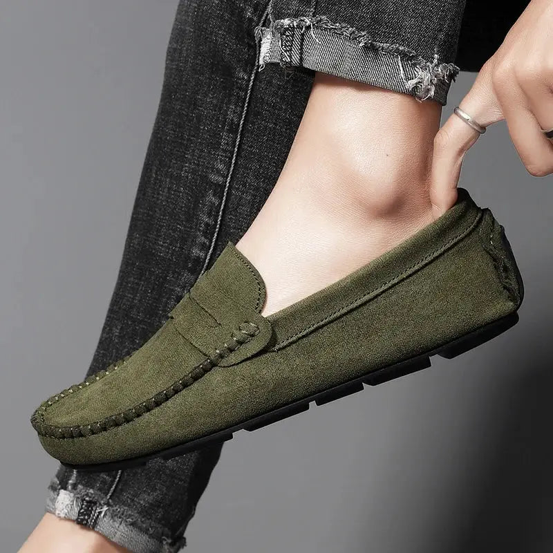 Olive green suede men's loafers with moccasin stitching and slip-on design with flexible rubber sole