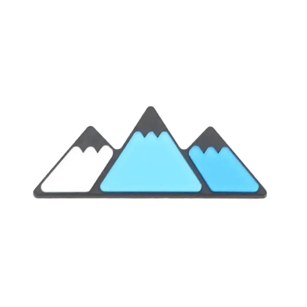 Grille badge emblem featuring a white and blue three-mountain design for Toyota vehicles