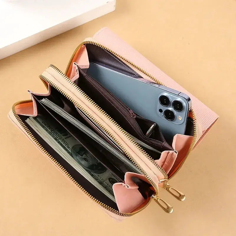 Women's pink mid-size wallet bag with gold zippers, convertible shoulder clutch and coin pocket