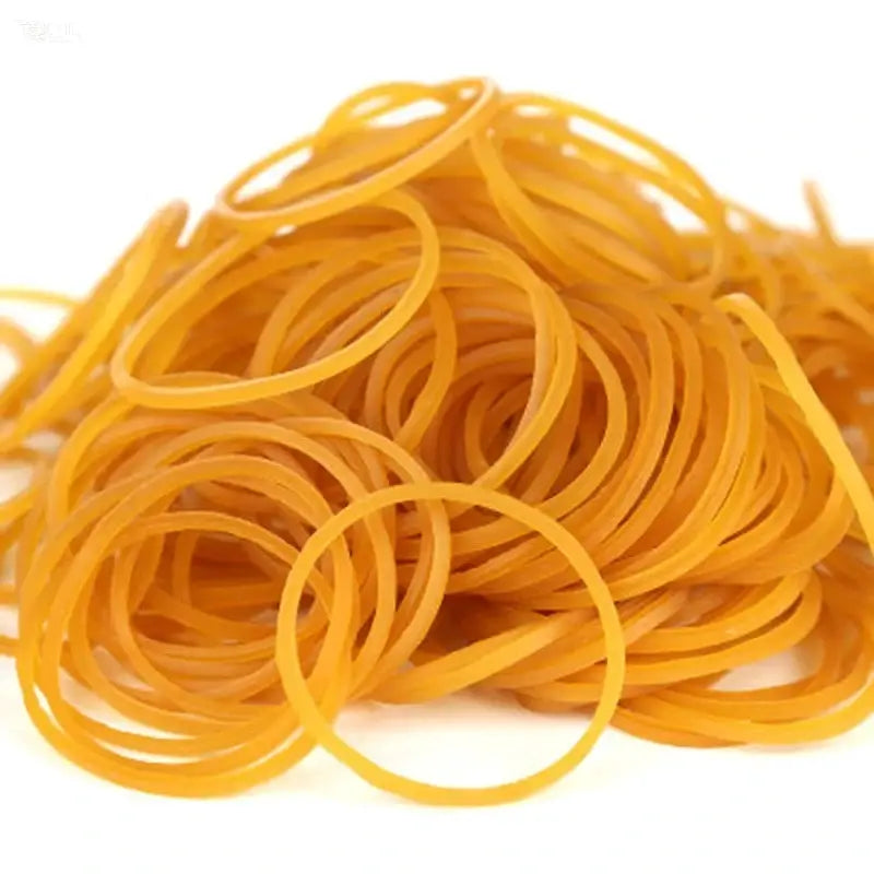 Yellow rubber bands tangled in a pile, many circular loops visible.