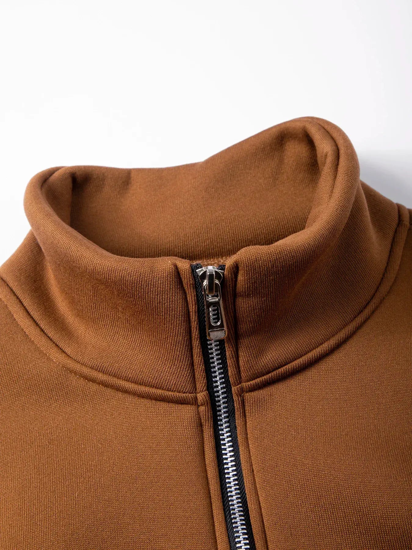 Men's brown zip-up fleece pullover with folded turtleneck collar.