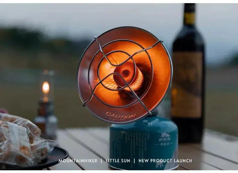 MOUNTAINHIKER portable mini sun gas stove on blue butane canister for outdoor camping, orange glow