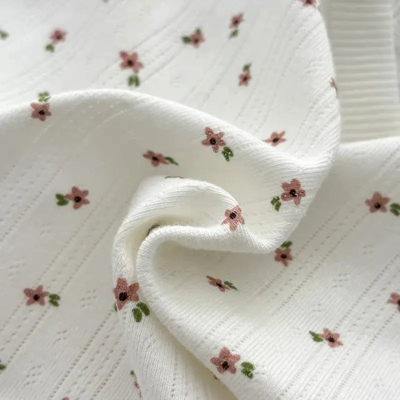 Underwear set: white soft fabric panties with pink floral print; breathable mid-rise.