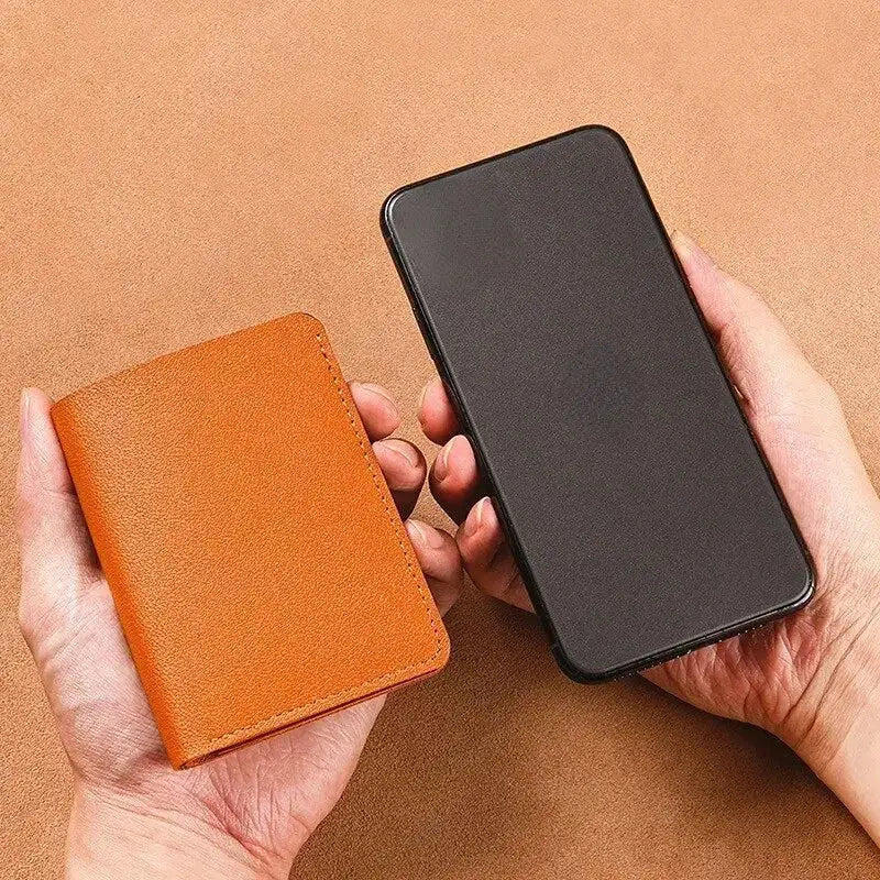Classic designer PU leather small wallet in tan; ultra-thin card holder beside a black smartphone.