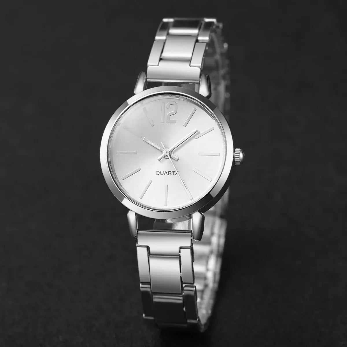 Silver-toned women's quartz wristwatch with stainless steel link band and round dial