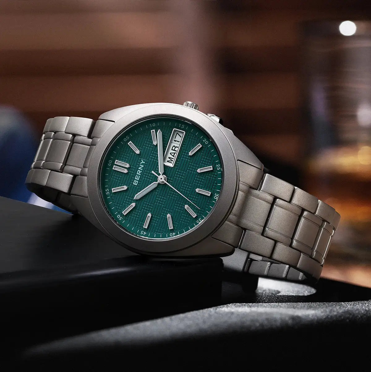 BERNY titanium men's wristwatch with green dial, date window, 38mm case, silver bracelet.