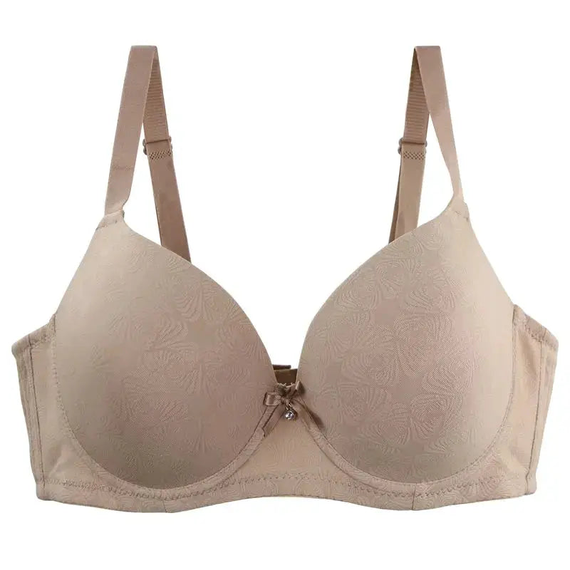 Beige DaiNaFang bra with floral pattern, padded cups, bow detail, and adjustable straps