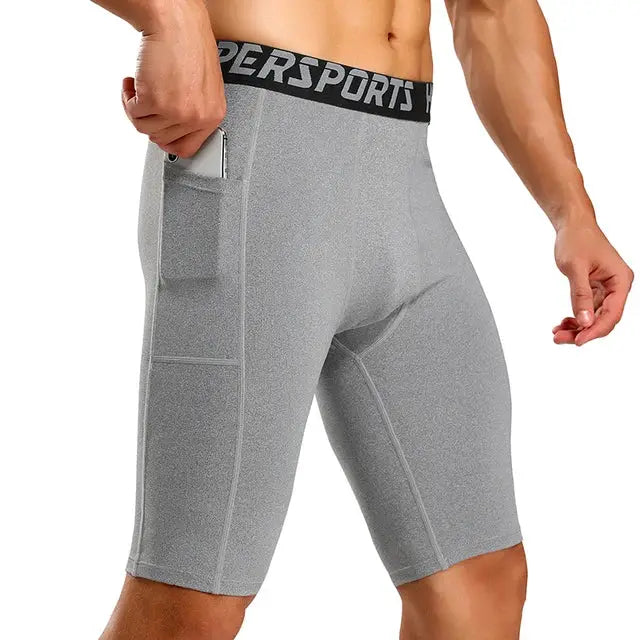 Men's gray compression shorts with side pocket and black elastic waistband.