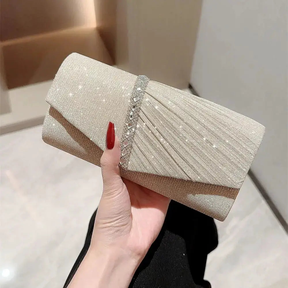 Sequined evening clutch in champagne gold with crystal-embellished band