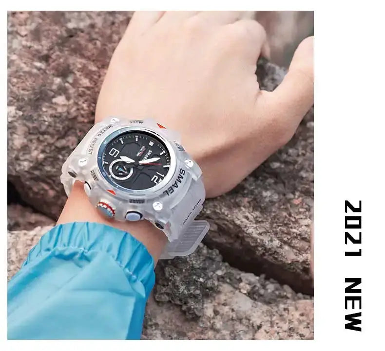 SMAEL sport watch on wrist; silver case, black dial, rugged outdoor setting