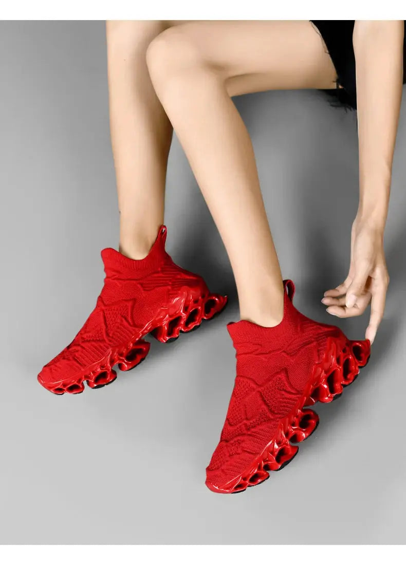 Sneakers, red knit upper with sculpted hollow-out outsole, pair of men's casual shoes