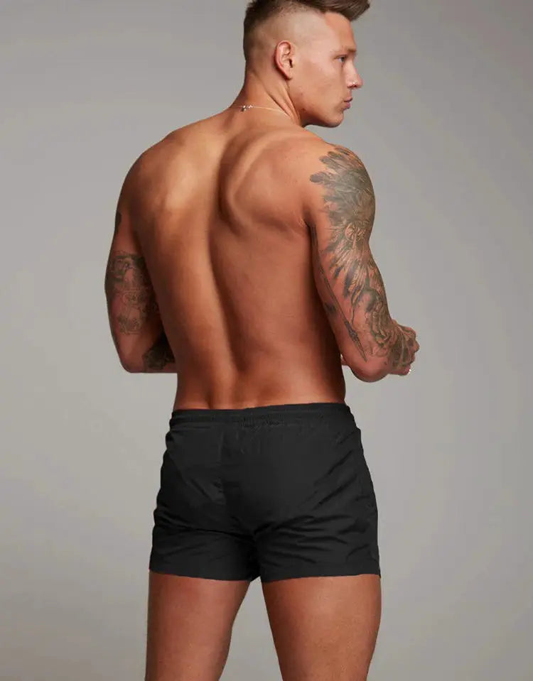 Men's gym shorts by Simples Market; black, lightweight, quick-drying with drawstring
