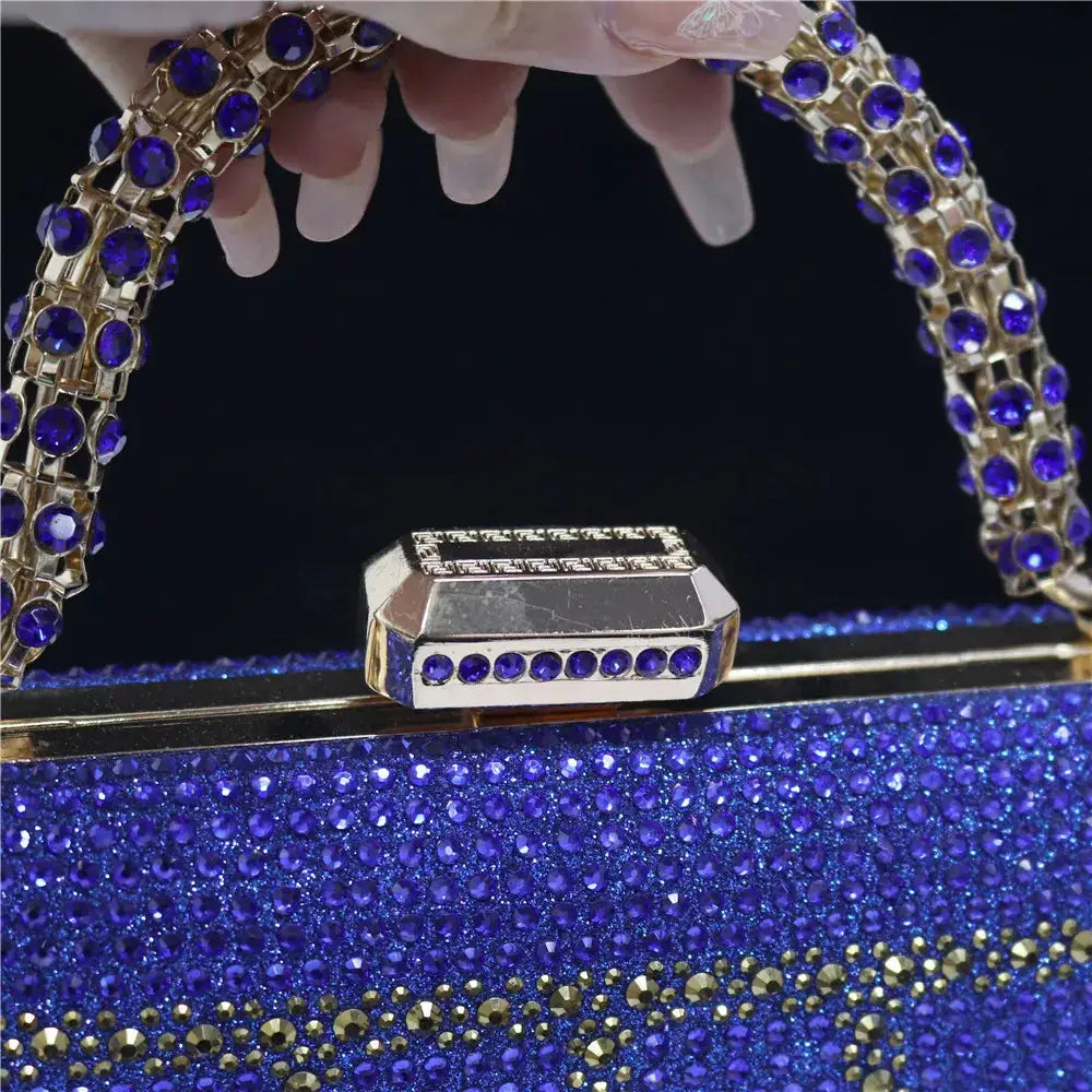 Evening clutch by Simples Market with diamond-design rhinestones and a blue crystal-studded chain handle