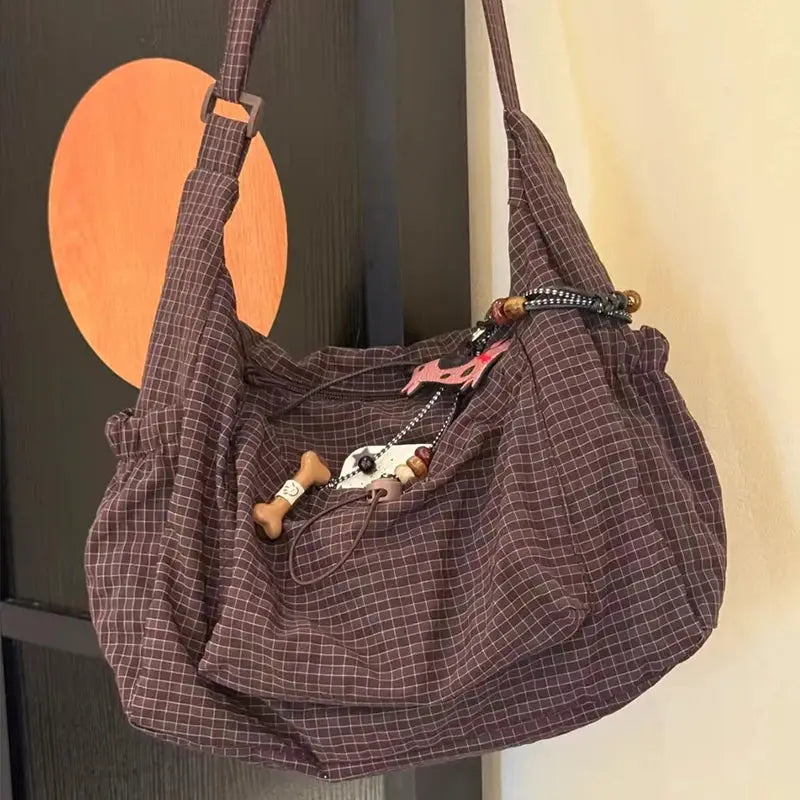 Simples Market plaid nylon shoulder bag with zipper, drawstring closure and crossbody strap in brown