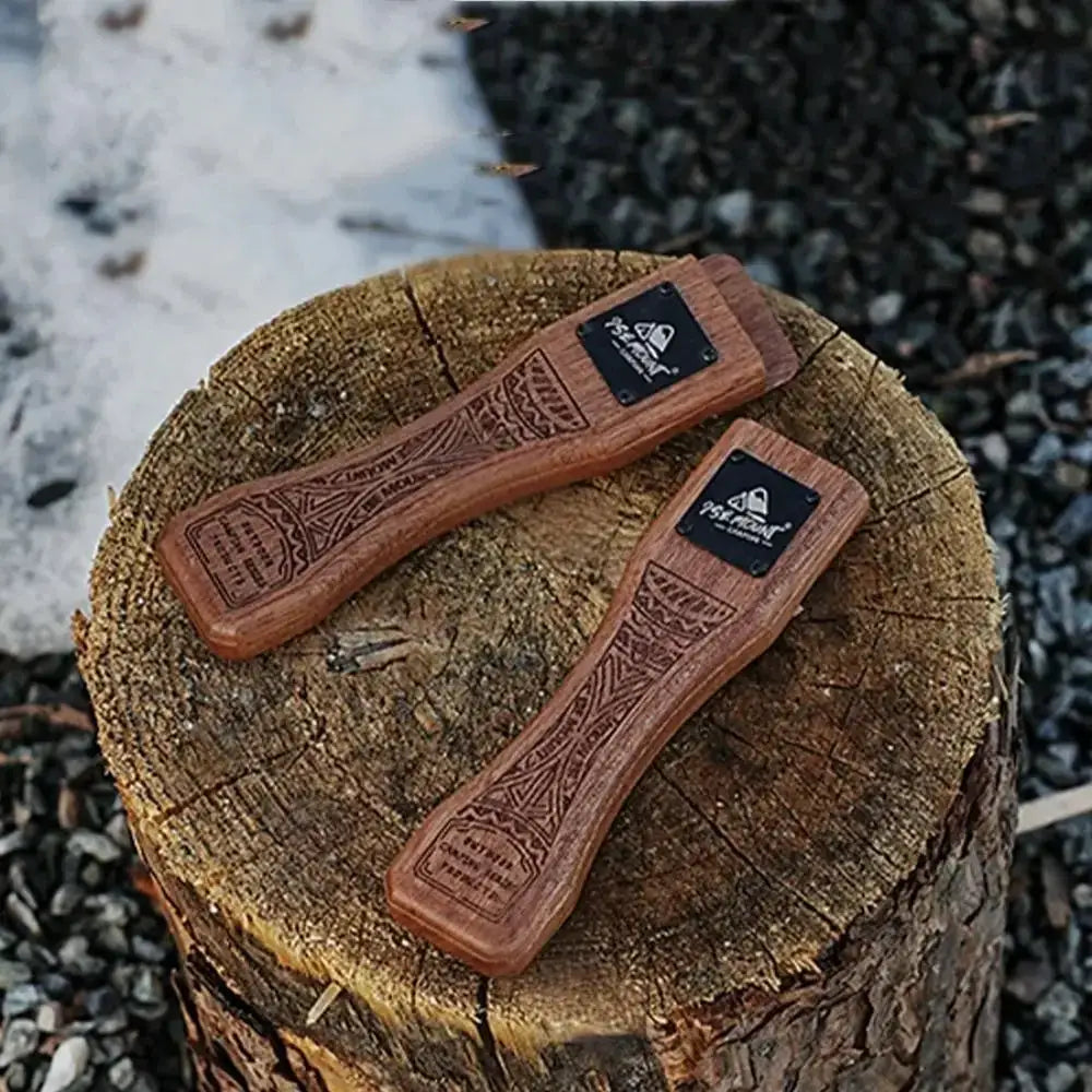 Outdoor grill pan handles by Simples Market; solid brown wood with carved patterns, black logo plates, two pieces
