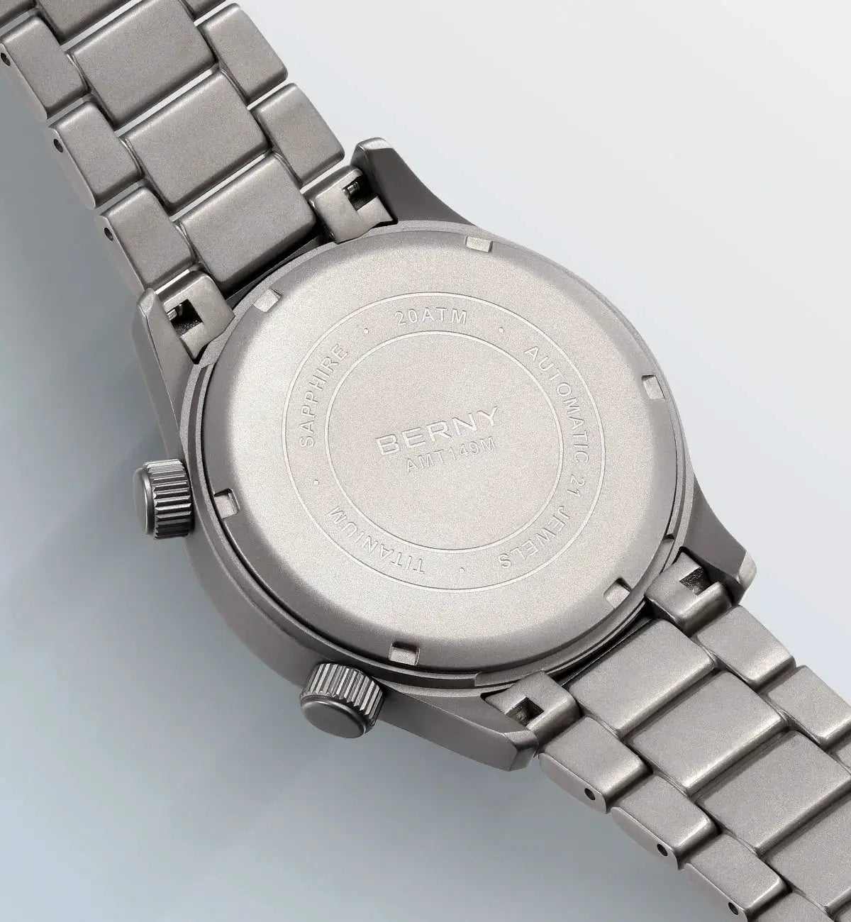 BERNY titanium automatic diver watch on a metal bracelet; case back shows 20ATM and sapphire.