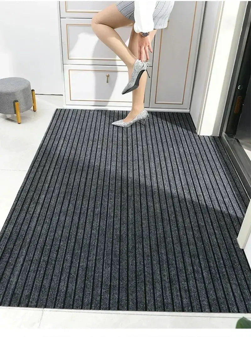 Door mat by Simples Market, dark gray striped entrance mat with anti-slip and water-absorbent design.