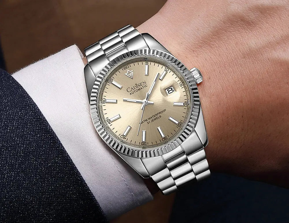 Cadisen men's automatic watch with stainless steel bracelet, beige dial, date window at 3 with magnifier, fluted bezel