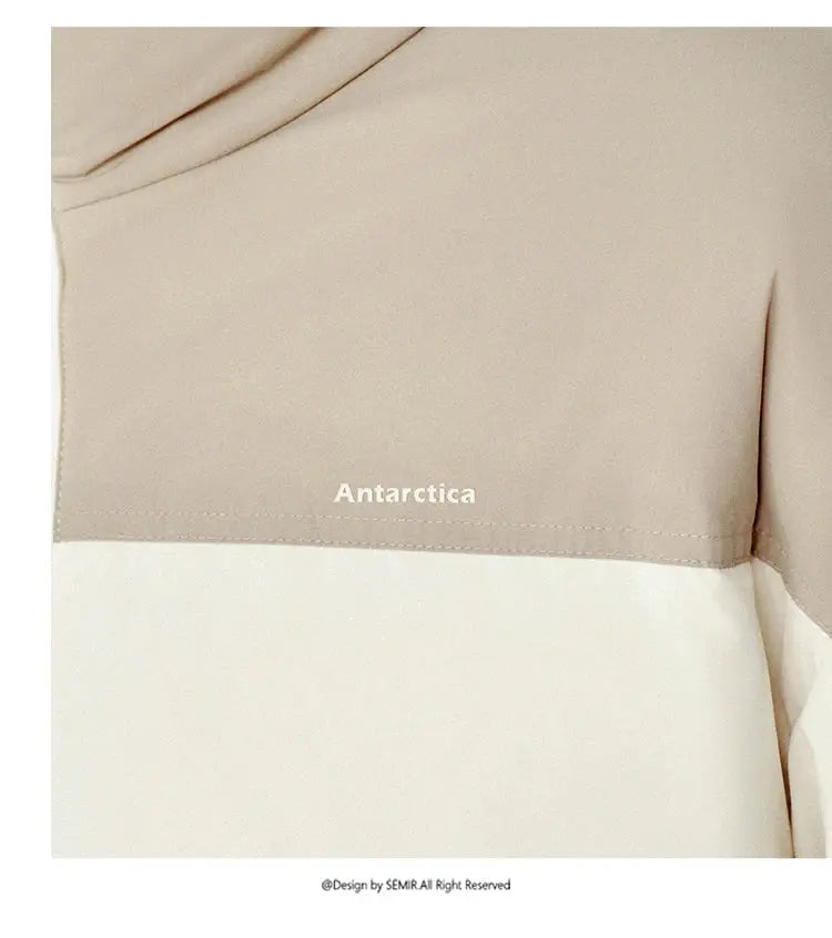 Puffer jacket in beige and cream color-block, Antarctica logo, windproof and waterproof outerwear for men and women.