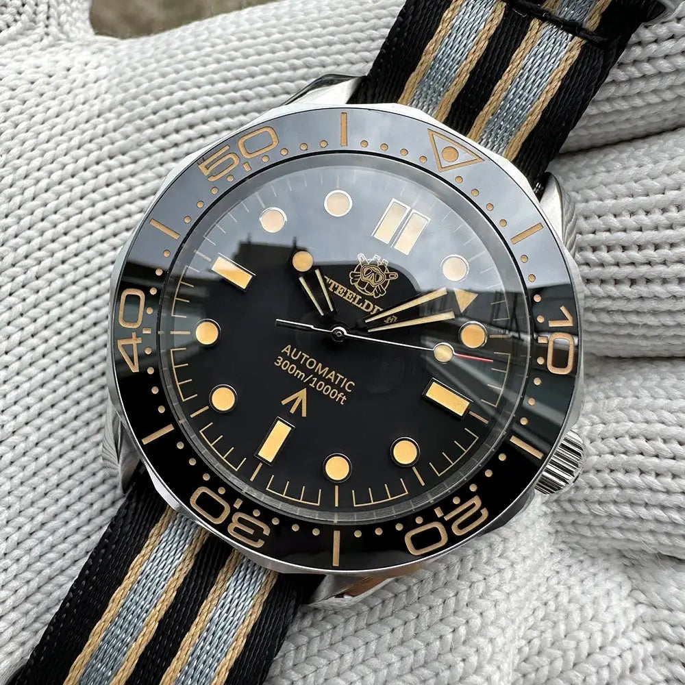 STEELDIVE SD1957 42mm diver watch with black dial, gold-tone markers, ceramic bezel, striped NATO strap