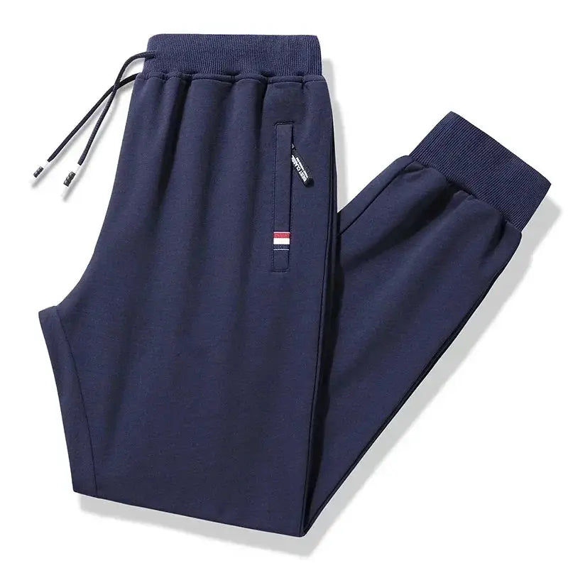 Men's navy cotton jogger sweatpants by Simples Market with elastic waist and zip pocket