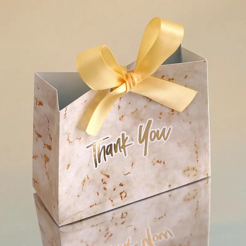 Simples Market mini gift bags with gold ribbon, marble pattern and Thank You text; two bags stacked.