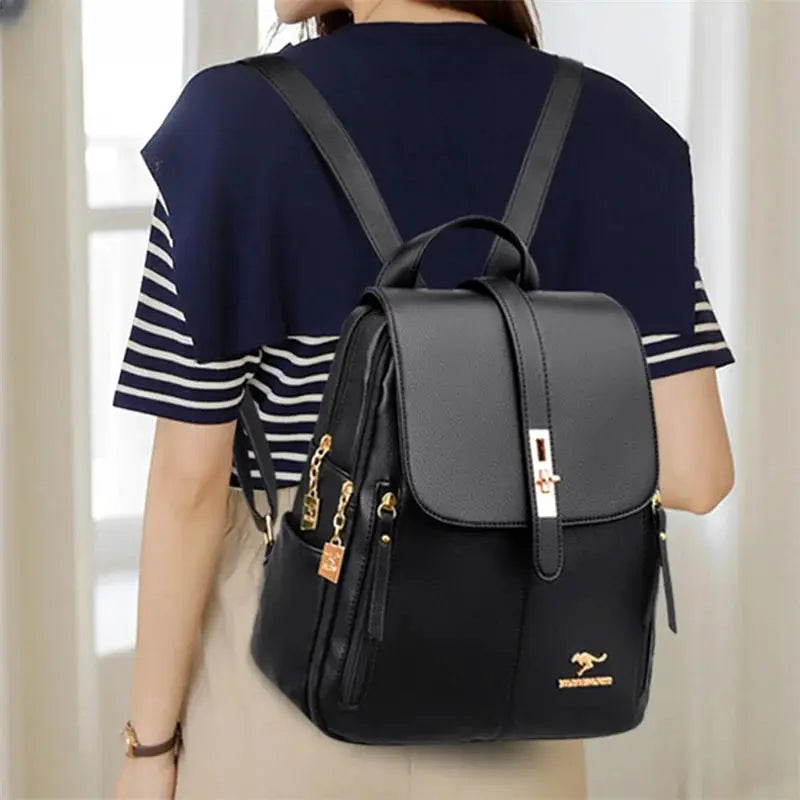 Backpack by Simples Market; black leather with gold hardware, top flap closure, for women
