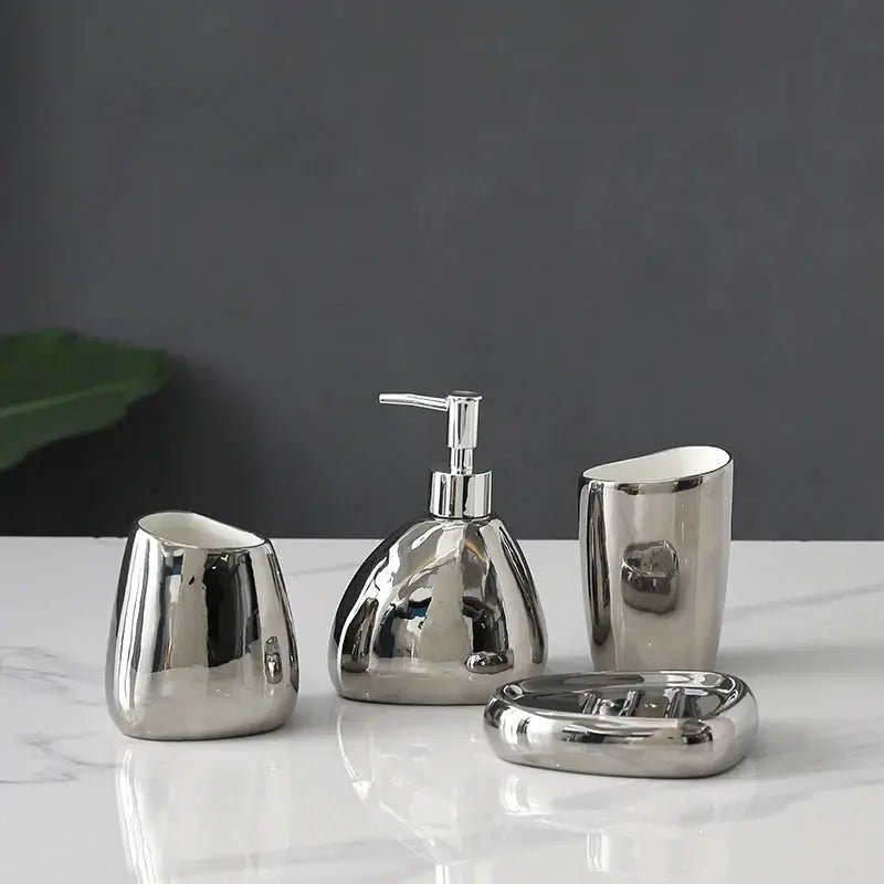 Silver metal bathroom accessory 4-piece set with soap dispenser, mouthwash cup, toothbrush holder and tray