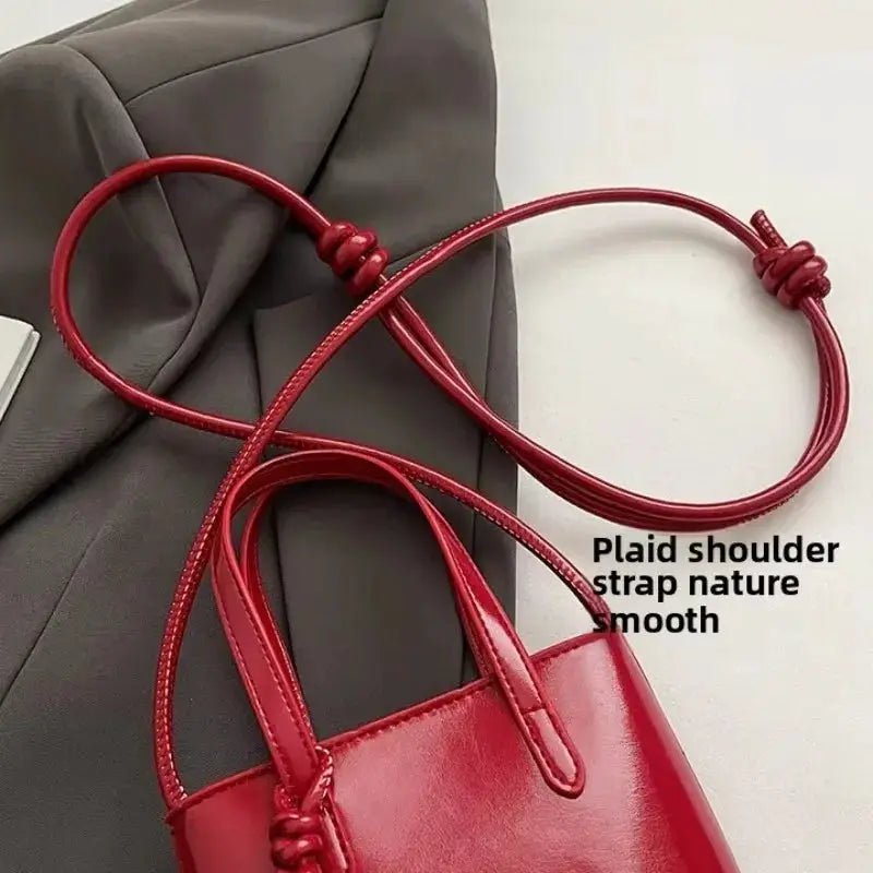 PU leather mini crossbody bag for women, red glossy finish with top handles and long strap