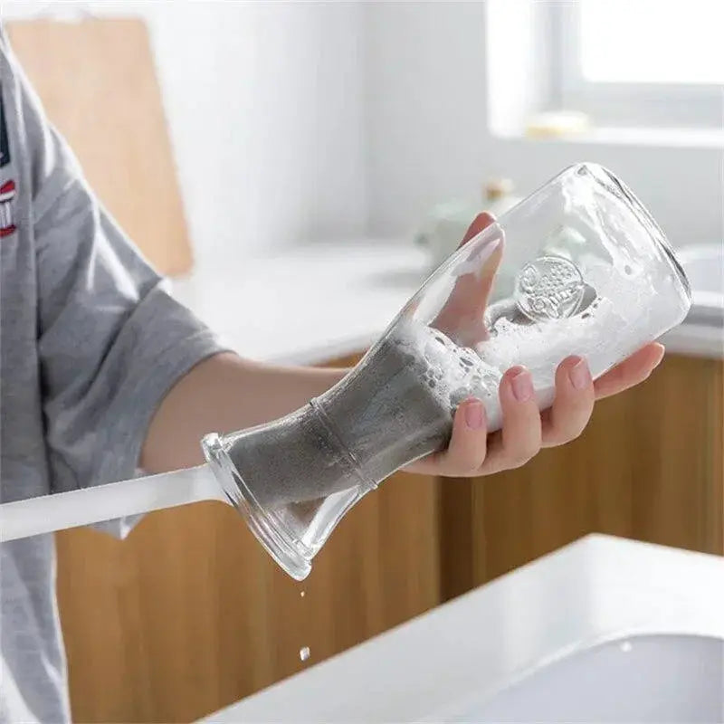 Long-handle sponge cup brush cleaning a glass bottle with soapy water