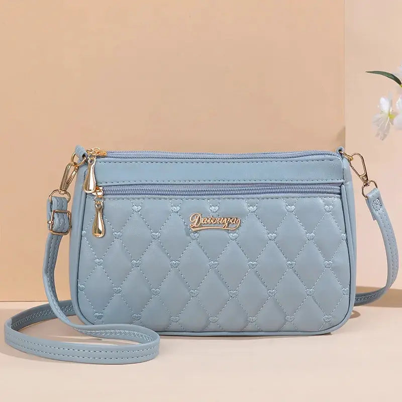 NovaLuxe PU Leather Messenger Bag For Women With Fur Ball Accent And Secure Zipper Closure
