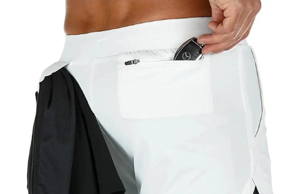 Men's 2-in-1 quick-dry fitness shorts by Simples Market; white outer shorts with black inner layer and zip pocket