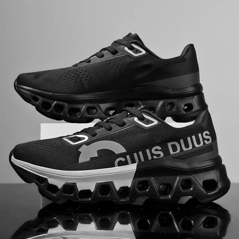 Pair of men's running shoes in black mesh with a chunky hollow-sole outsole for off-road cushioning