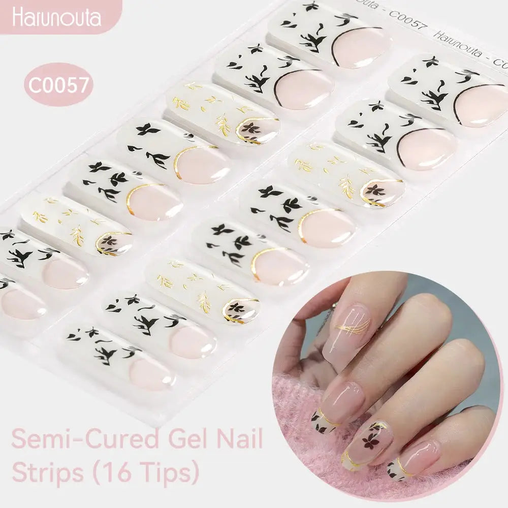 Gradient Auroras semi-cured gel nail strips, 16 tips with white-to-pink gradient, black botanical silhouettes and gold foil accents, Harunouta