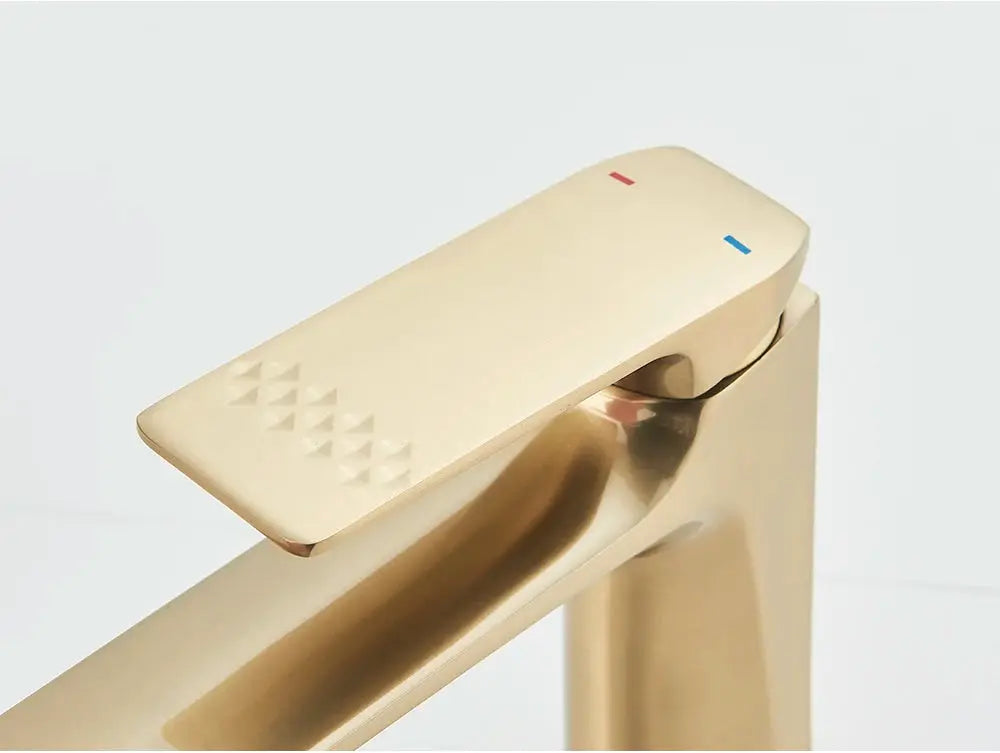 Brushed gold deck-mounted bathroom faucet with a single-lever basin mixer