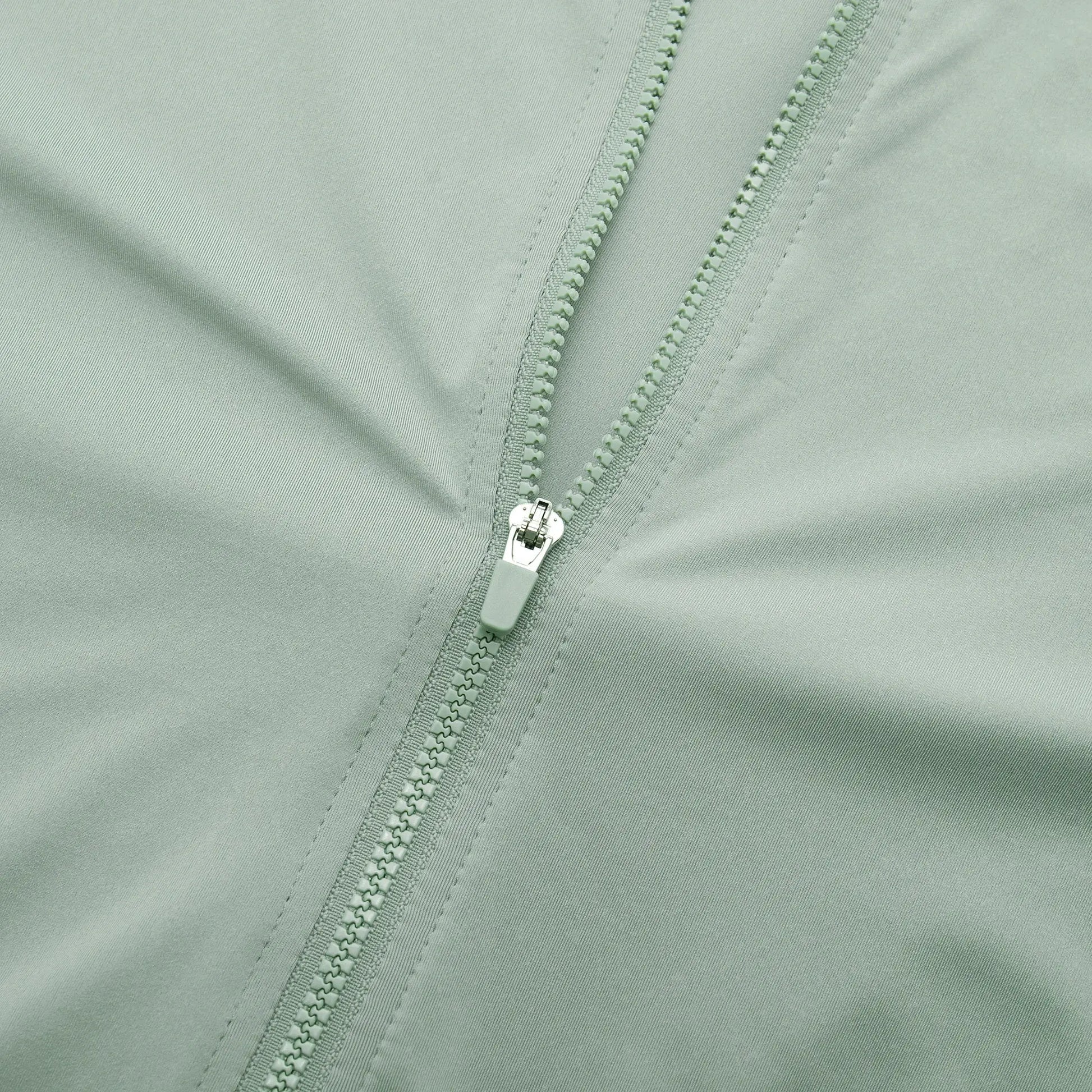YKYWBIKE men's cycling jersey close-up in mint green with dual zippers
