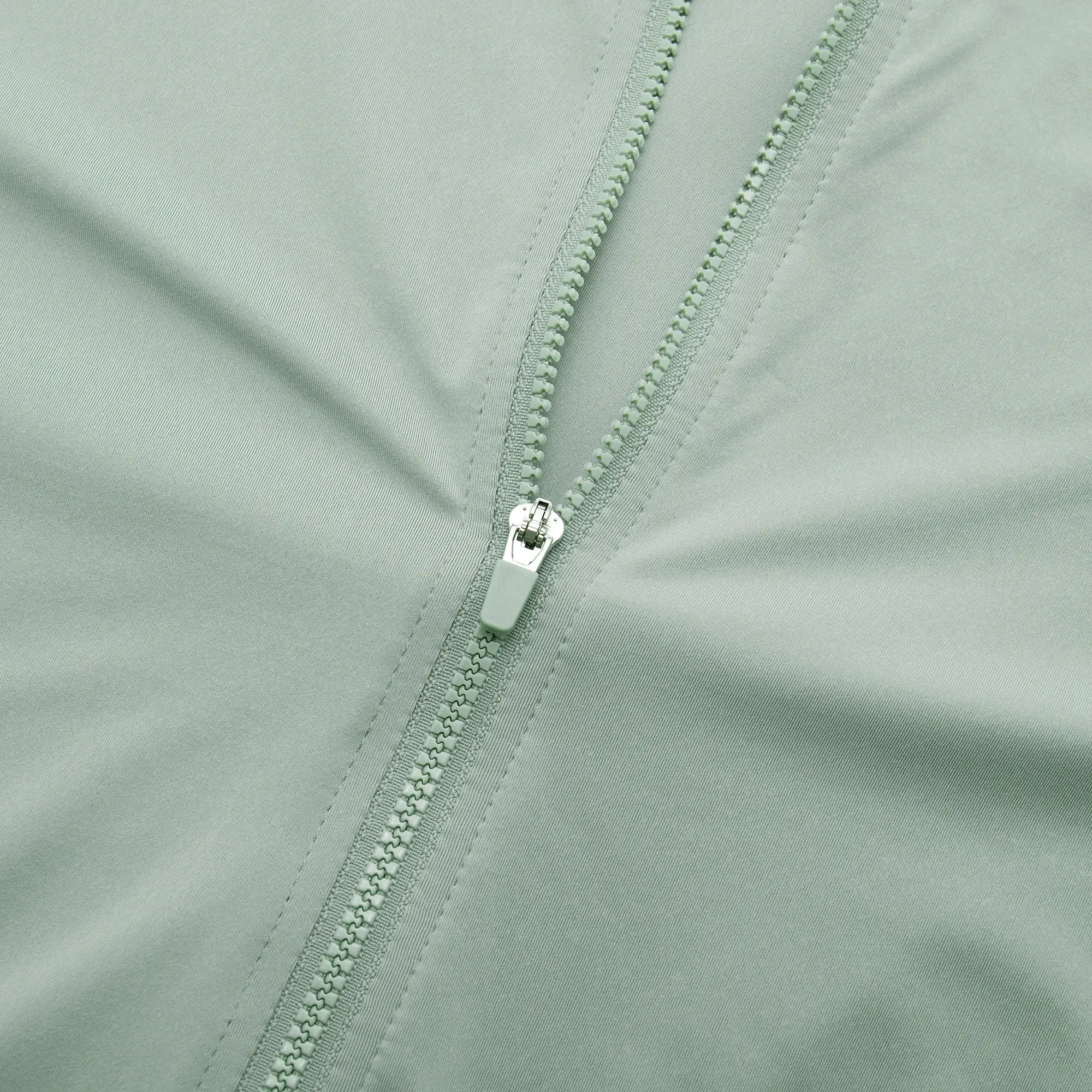 YKYWBIKE men's cycling jersey close-up in mint green with dual zippers