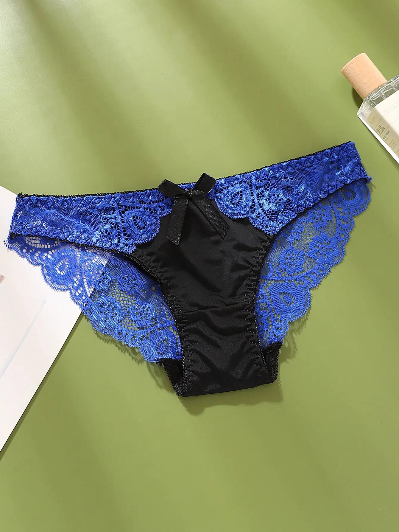 Women's blue lace color-block briefs by Simples Market with black satin panel and bow