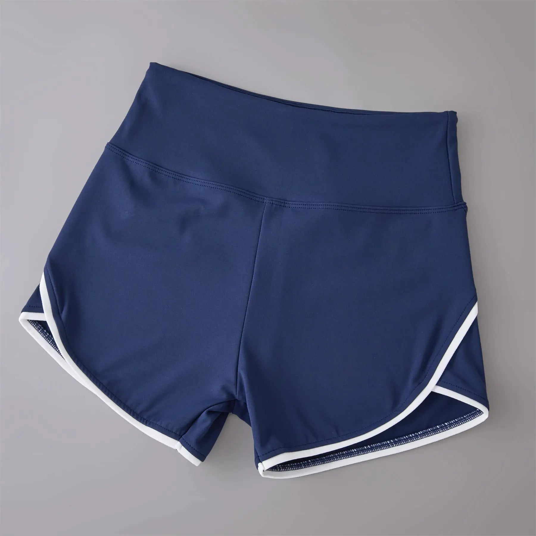 High-waist navy blue sports shorts with white trim, stretchy athletic shorts for yoga and training.