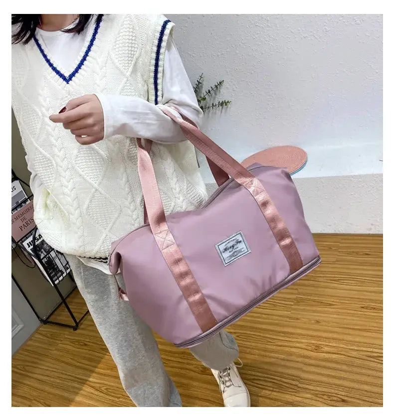 UNIXINU pink nylon carry-on duffle bag by Simples Market with rose-gold satin handles