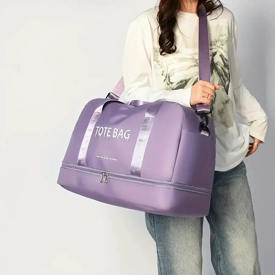 Purple large-capacity travel duffle bag with adjustable shoulder strap and durable nylon.