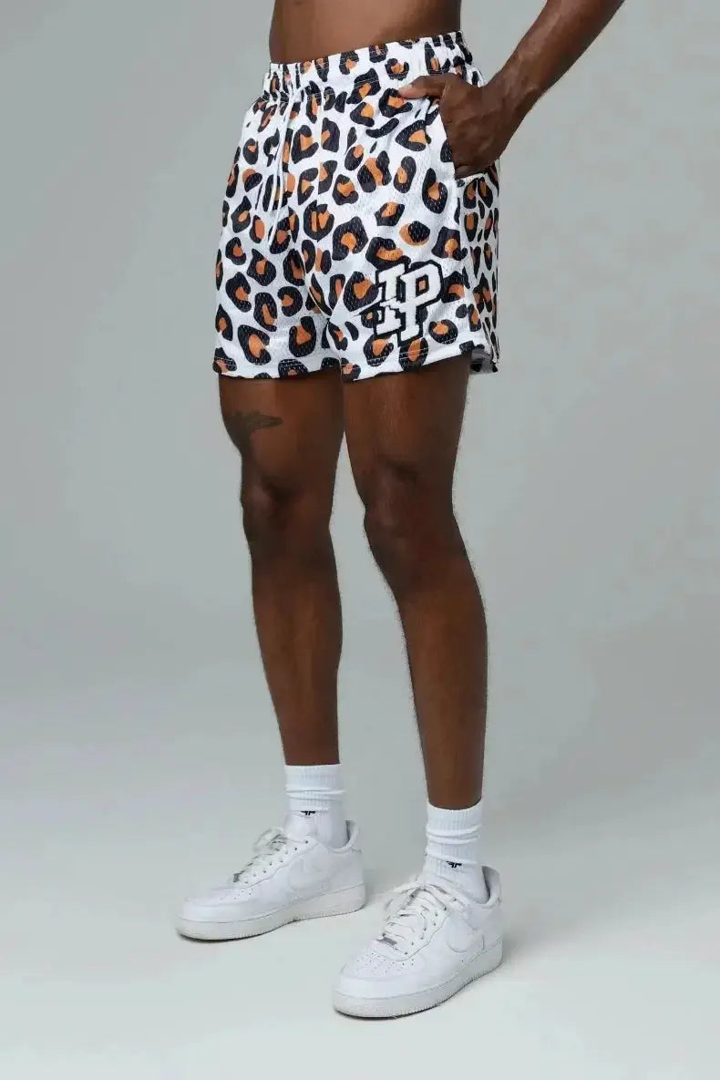Men's leopard-print mesh shorts in white with brown and black spots; quick-dry athletic shorts.