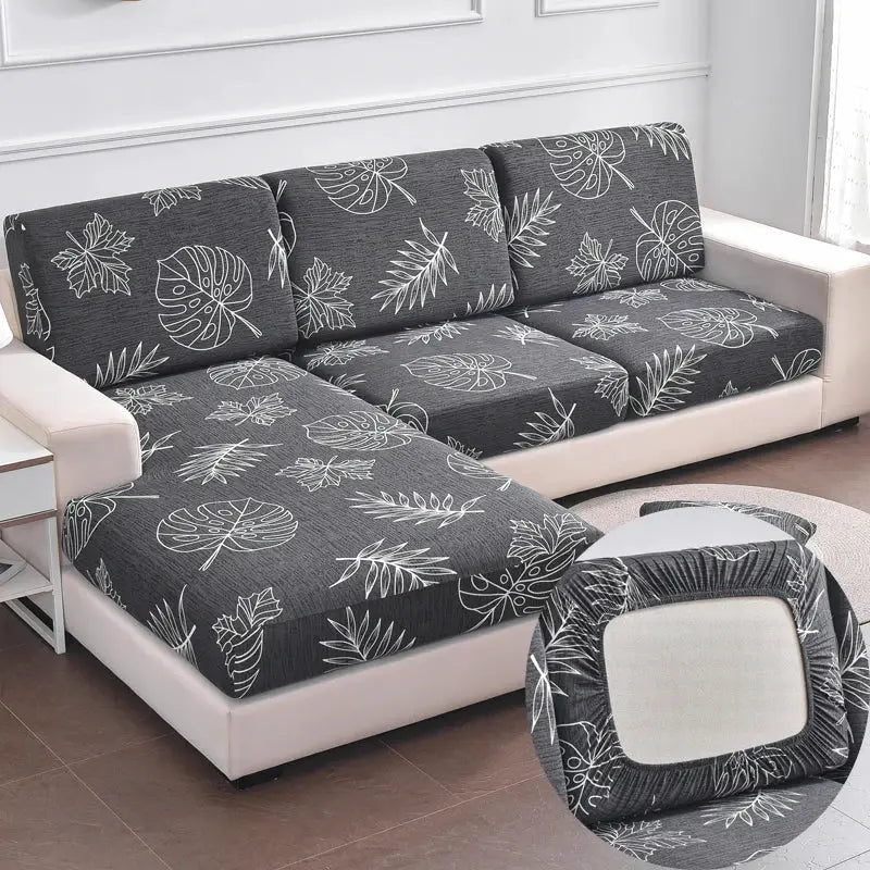 Geometric print sofa cover for corner sofa; grey stretch slipcover with white leaf pattern