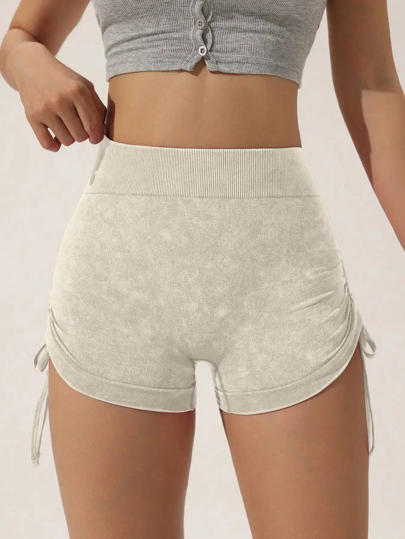 Drawstring frosted shorts for women in cream with ribbed waistband and side ties